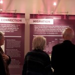 Guests look at Germans in Britain exhibition panels: 'The German Connection', 'Migration' and 'Today'